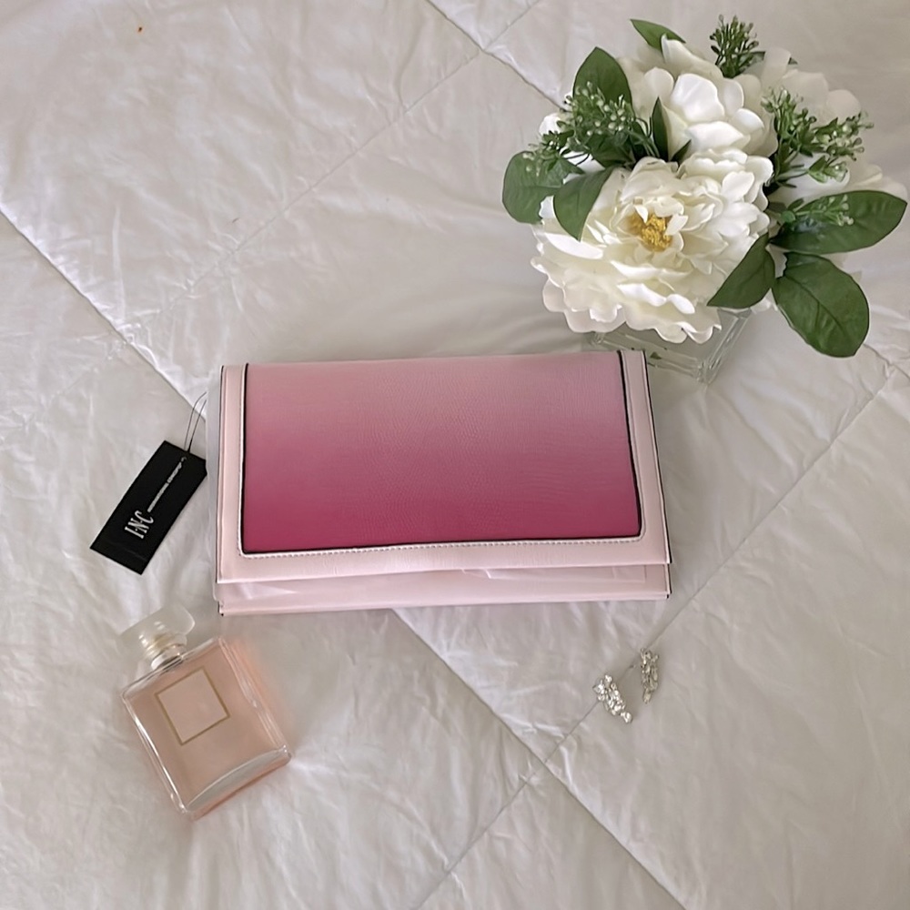 INC International large gradient pink clutch.